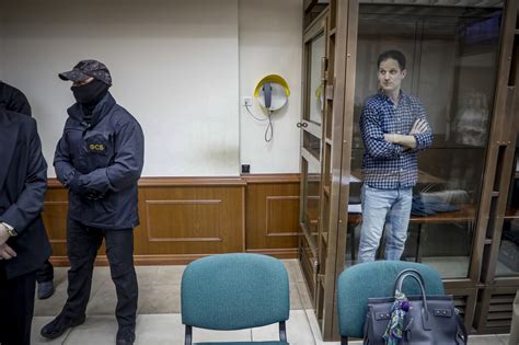Jailed WSJ reporter Evan Gershkovich arrives at a Moscow court for hearing on extending his detention